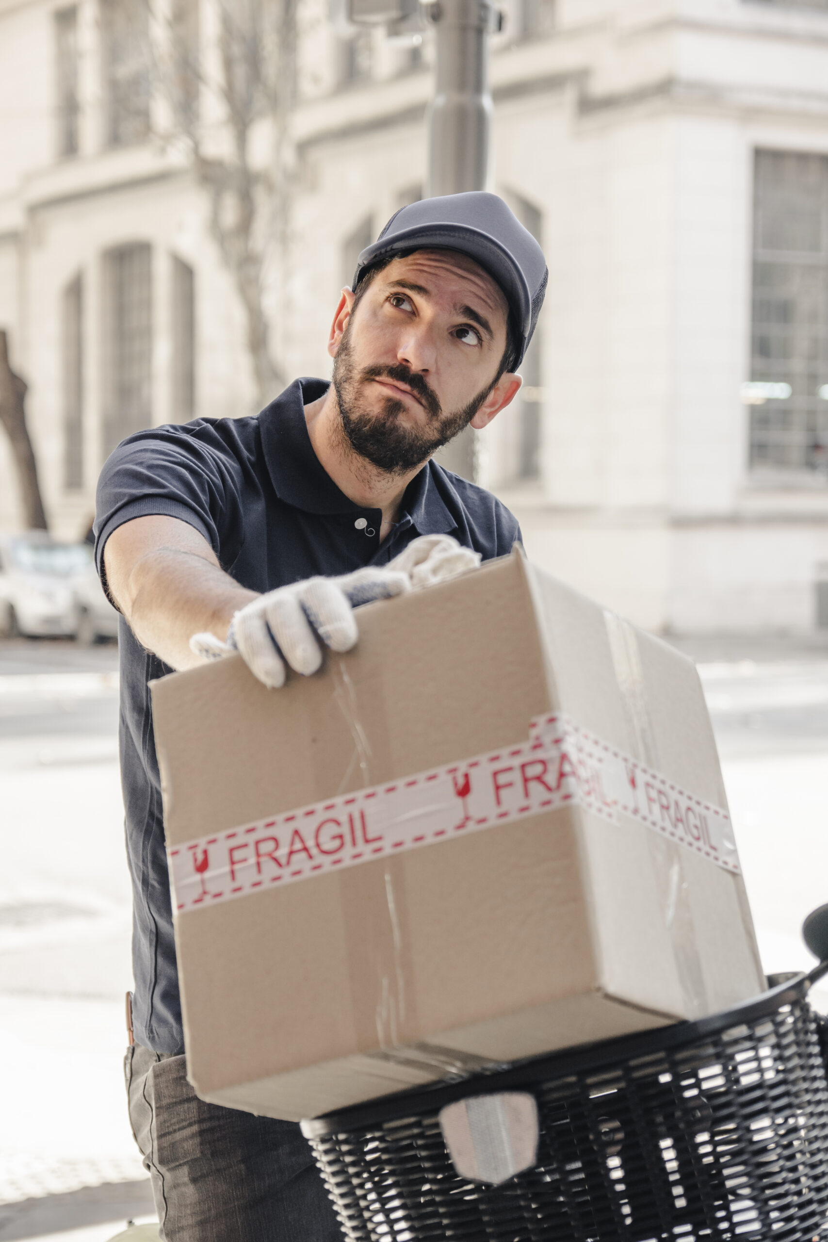delivery-man-with-parcel-looking-away